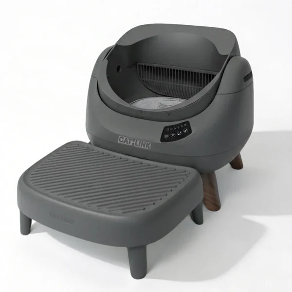 Grey automatic smart cat litter box with a ribbed litter catcher step on a white background.
