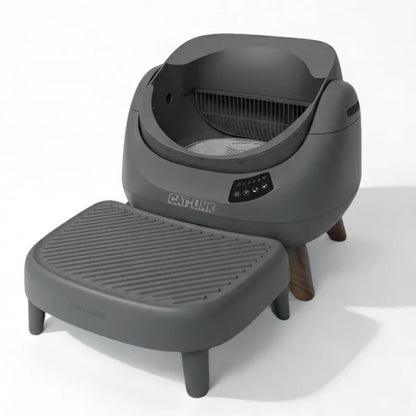 Grey automatic smart cat litter box with a ribbed litter catcher step on a white background.