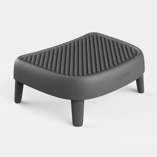 Grey plastic textured cat litter trap step and ramp with four legs.