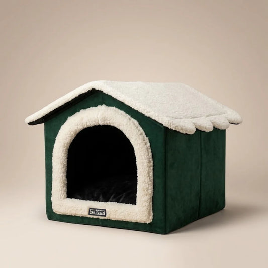 Green plush cat cave and small dog house bed with white sherpa roofing.